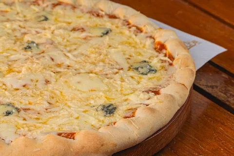 Four cheese pizza with a golden crust